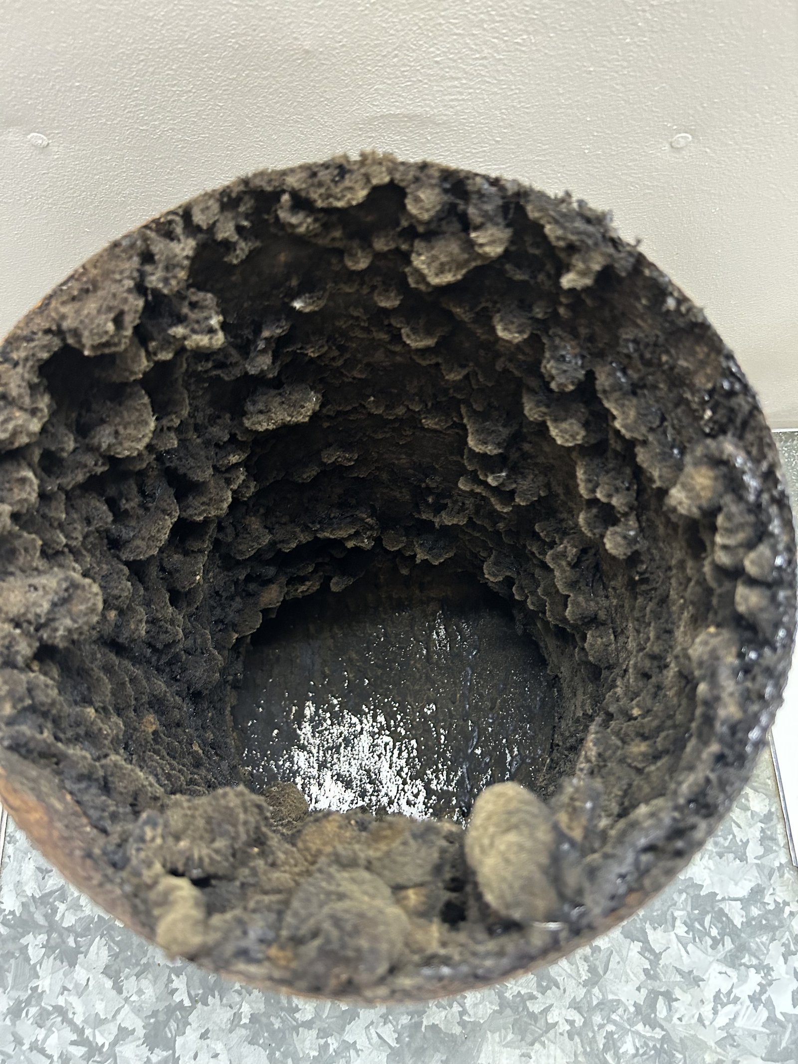 Heavily corroded or dirty metal pipe interior